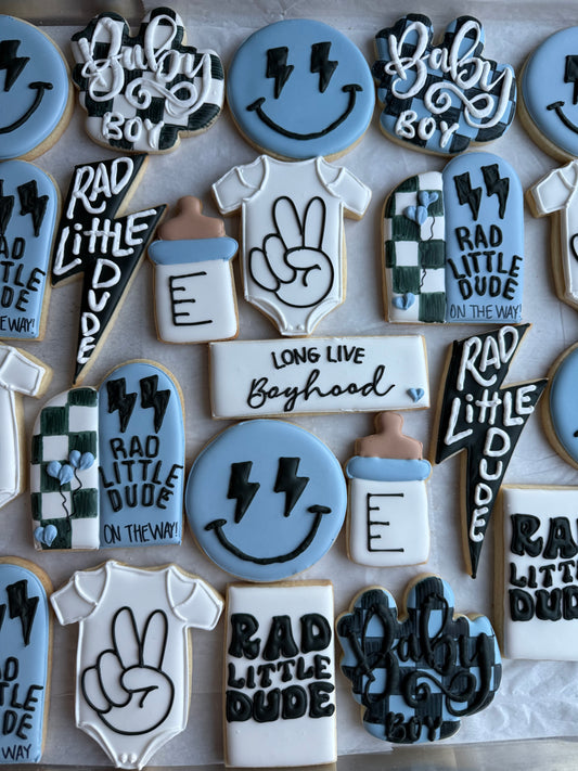 Decorative cookies with text and graphics on a white surface