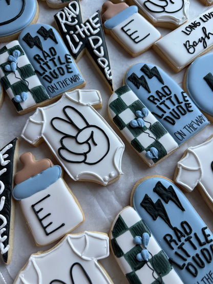 Decorative cookies with text and graphics on a white surface
